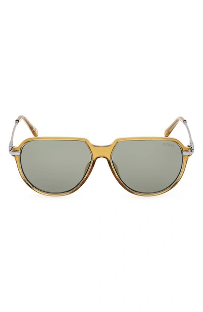 Shop Guess 56mm Aviator Sunglasses In Yellow / Green