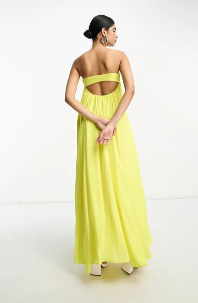 Shop Asos Design Cutout Strapless Trapeze Maxi Dress In Yellow
