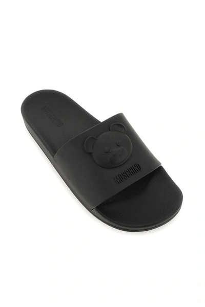 Shop Moschino Rubber Slides With Embossed Teddy Bear