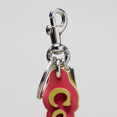 Shop Coach Topia Bag Charm In Topia Leather In Strawberry Haze/lime Green