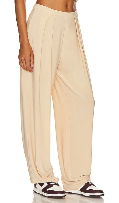 Shop Norma Kamali Tapered Pleated Trouser In Nude