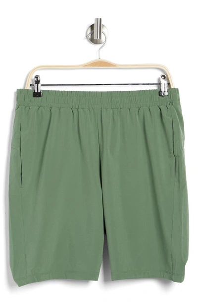 Shop Z By Zella Traverse Woven Shorts In Green Elm
