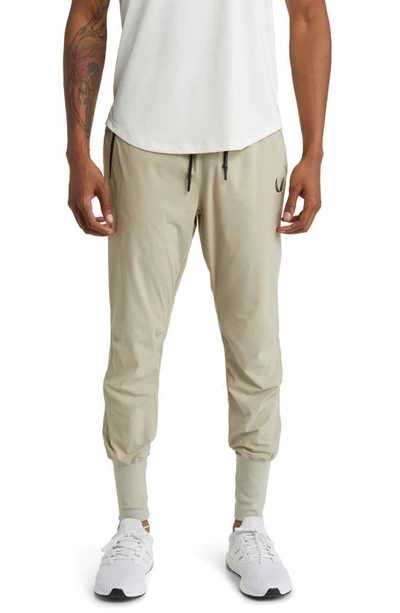 Shop Asrv Tetra-light Joggers In Sand Smoke