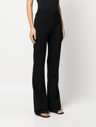 Shop Pinko High-waisted Flared Crepe Trousers In Black