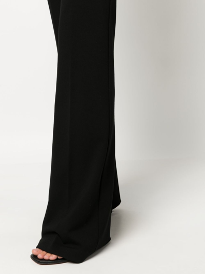 Shop Pinko High-waisted Flared Crepe Trousers In Black