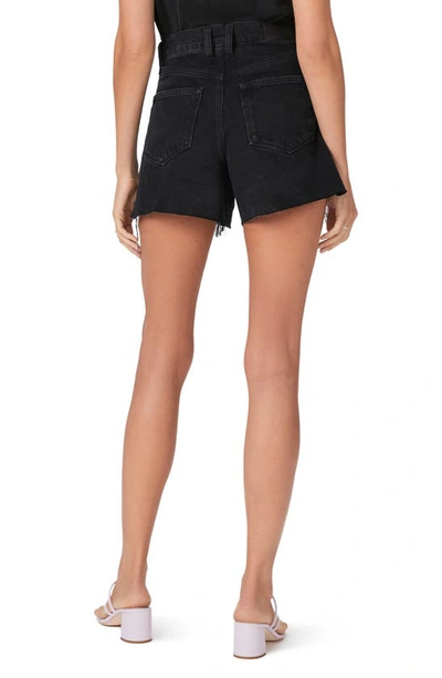 Shop Paige Asher Asymmetric Raw Hem Denim Shorts In Fade To Black Destructed