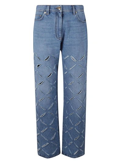 Shop Versace Rip Detail Jeans In Blue