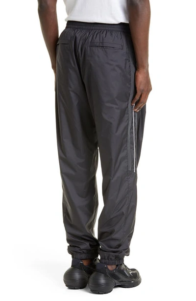 Shop Givenchy Relaxed Fit Logo Embroidered Track Pants In Black