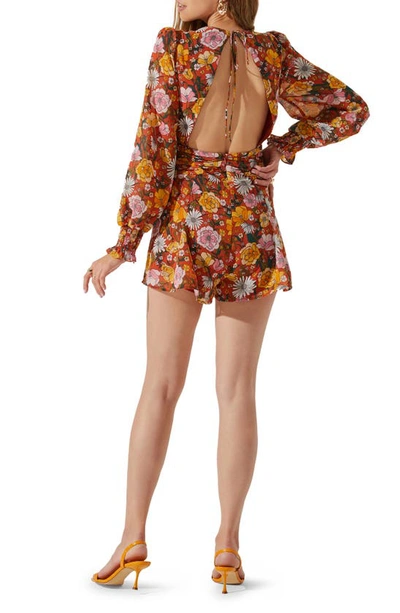 Shop Astr Floral Open Back Long Sleeve Chiffon Romper In Yellow Spice Floral