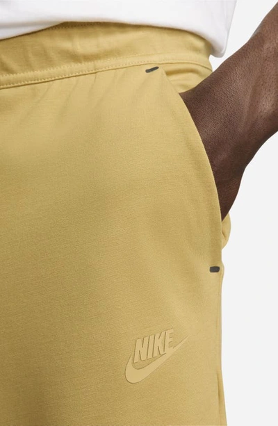 Shop Nike Tech Essentials Joggers In Wheat Gold/ Wheat Gold