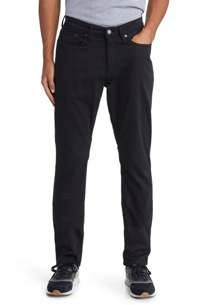 Shop Duer No Sweat Relaxed Tapered Performance Pants In Black