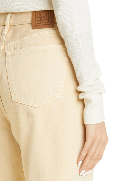 Shop Totême Twisted Seam Straight Leg Jeans In Washed Beige