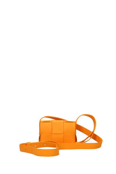 Shop Bottega Veneta Crossbody Bag Cassette Leather Orange Mandarin