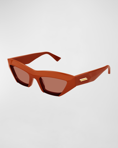 Shop Bottega Veneta Raised Logo Acetate Cat-eye Sunglasses In Shiny Solid Orang