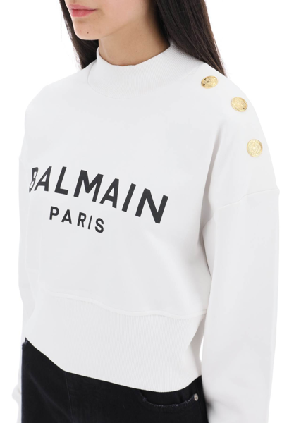 Shop Balmain Cropped Sweatshirt With Logo Print And Buttons In Blanc Noir (white)