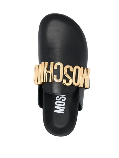 Shop Moschino Leather Mules With Logo Plaque In Black