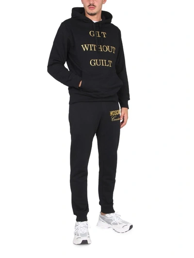 Shop Moschino "guilt Without Guilt" Sweatshirt In Black