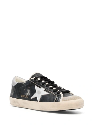 Shop Golden Goose 'super-star' Black Low Top Sneakers With Logo Patch And Suede Details In Leather Man