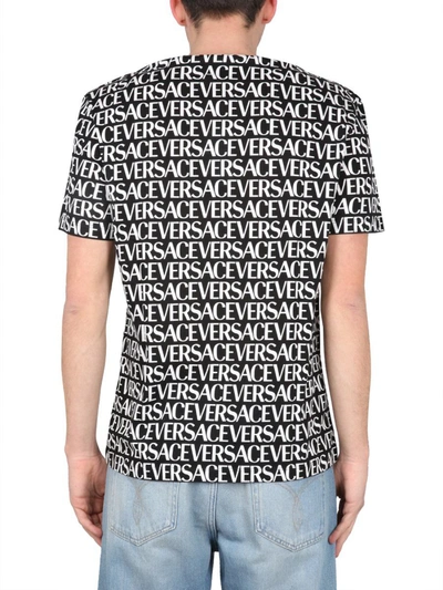 Shop Versace Allover Logo T-shirt In Black