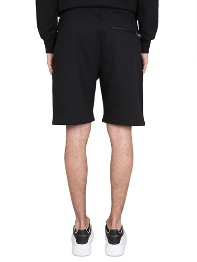 Shop Alexander Mcqueen Bermuda Shorts With Graffiti Logo Print In Black