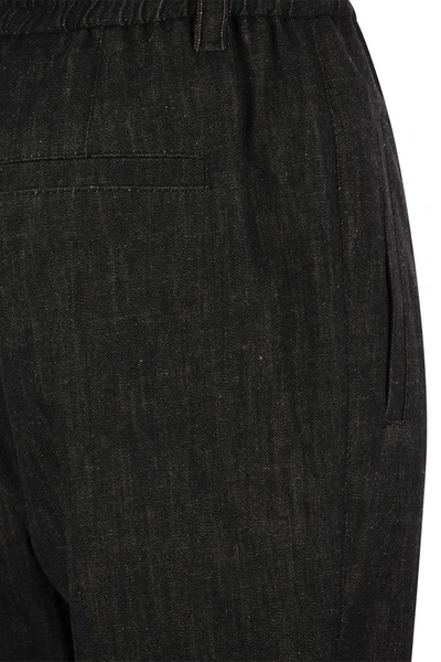 Shop Brunello Cucinelli Baggy Trousers In Dark Polished Denim In Black