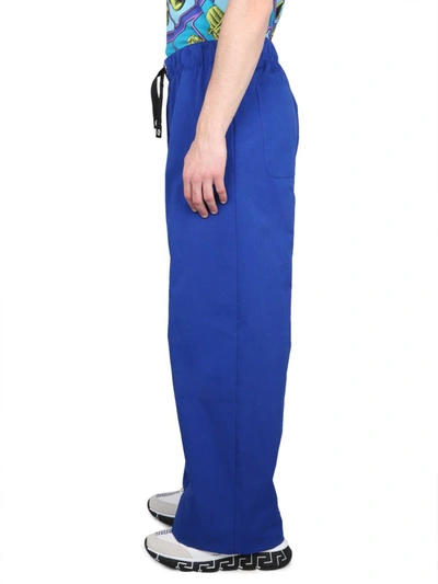 Shop Versace Drawstring Pants In Blue