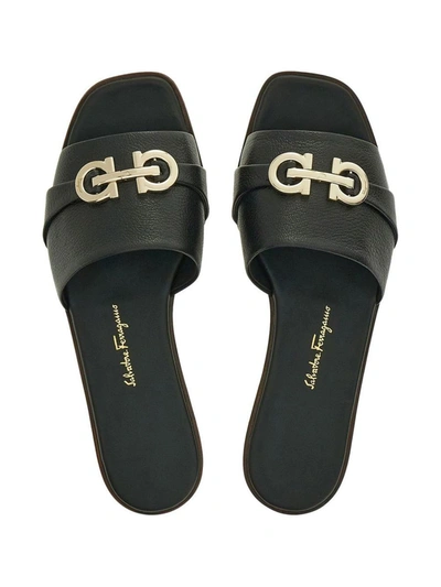 Shop Ferragamo Gancini Leather Flat Sandals In Black