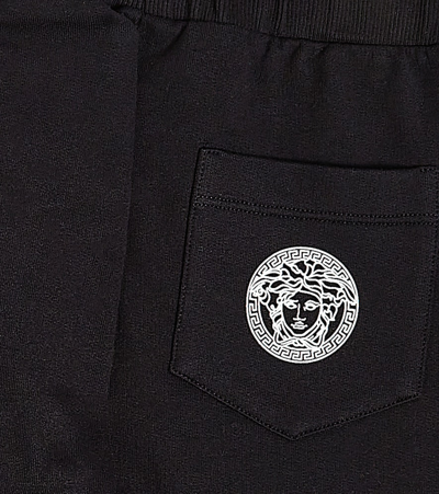 Shop Versace Printed Cotton Fleece Sweatpants In Blue