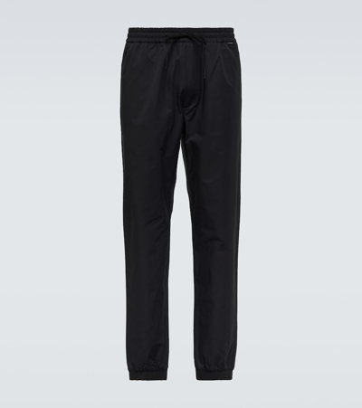 Shop Moncler Logo Cotton-blend Sweatpants In Black