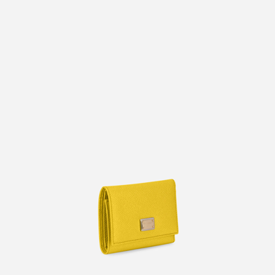 Shop Dolce & Gabbana Dauphine Calfskin French-flap Wallet In Yellow