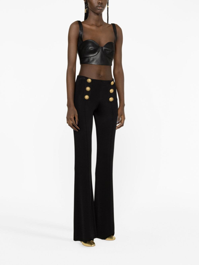 Shop Balmain Button-embellished Flared Trousers In Black
