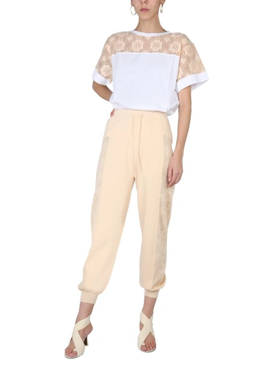 Shop Boutique Moschino Jogging Pants In Ivory