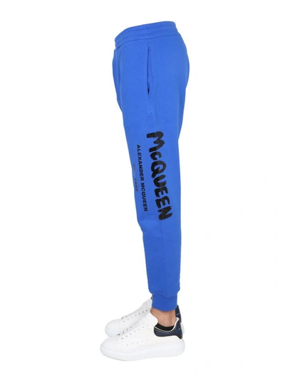 Shop Alexander Mcqueen Jogging Pants With Graffiti Logo In Blue