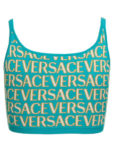 Shop Versace Light Blue Crop Top With All-over Logo Lettering And Medusa Detail In Cotton Blend Woman