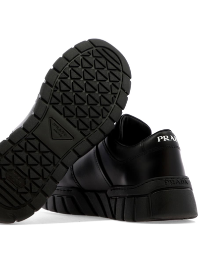 Shop Prada Sneakers In Nero