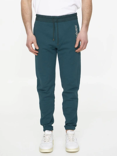 Shop Saint Laurent Track Pants In Green