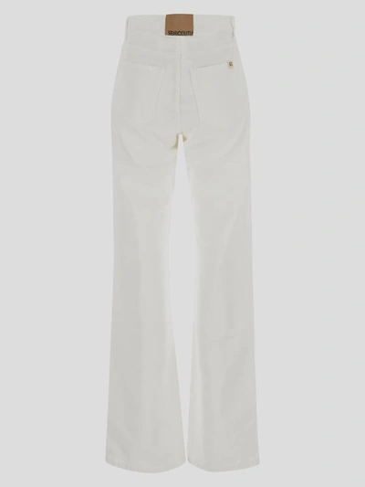 Shop Semicouture Flared Jeans In White