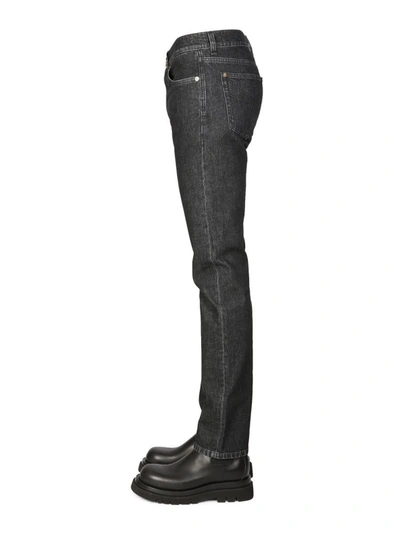 Shop Versace Slim Fit Jeans In Black