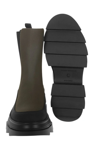 Stuart Weitzman Chelsea Boots With Lug Sole And Pull Tab In Black/green