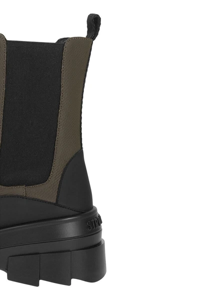 Stuart Weitzman Chelsea Boots With Lug Sole And Pull Tab In Black/green