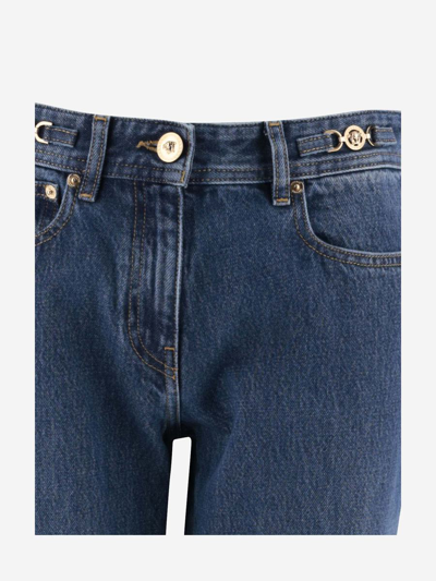 Versace Cotton Bootcut Denims With Logoed Morsets 32cm In Blu