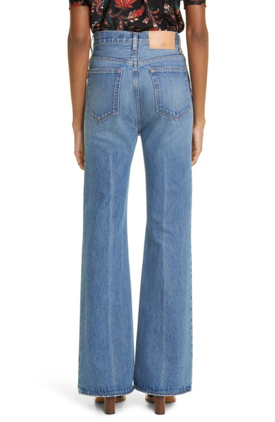 Shop Ulla Johnson The Lou Button Fly Flare Jeans In Danube Medium Indigo Wash