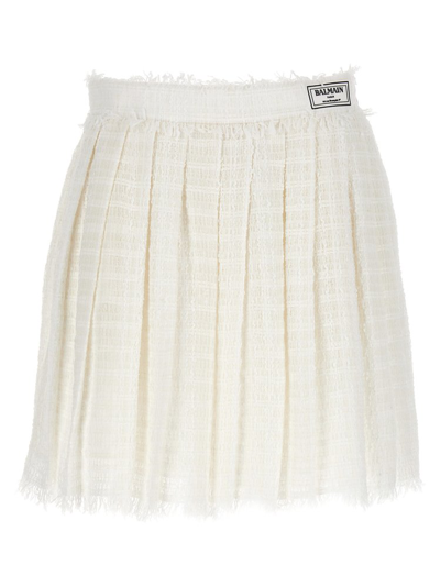Shop Balmain Logo Patch Pleated Tweed Mini Skirt In White