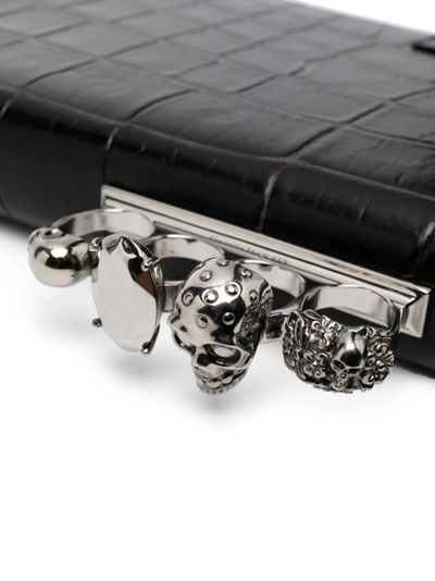 Shop Alexander Mcqueen Four Ring Crocodile-effect Clutch Bag In Black