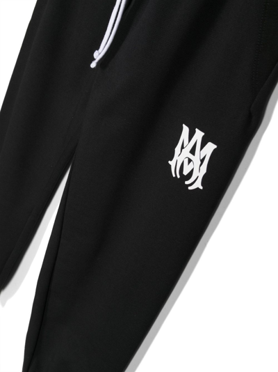 Shop Amiri Logo-print Cotton Track Trousers In Black
