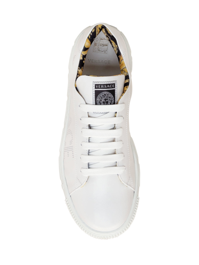 Shop Versace La Greca Sneaker In Bianco Nero Oro