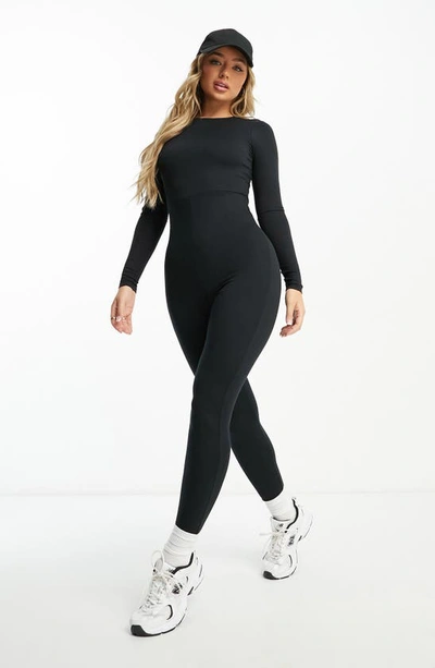 Shop Asos Design Long Sleeve Jersey Jumpsuit In Black