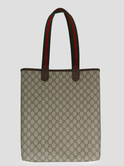 Shop Gucci Small Ophidia Gg Shopping Bag In Brown