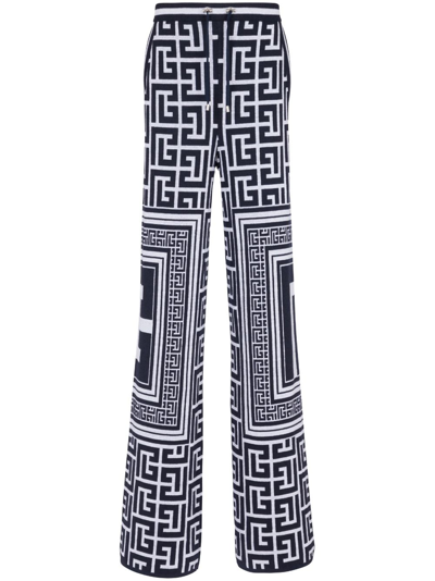 Shop Balmain Monogram-pattern Straight-leg Trousers In Black