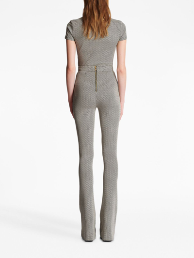 Shop Balmain Monogram Jacquard Flared Trousers In Gfe